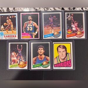 Vintage NBA basketball card lot featuring multiple Hall of Famers